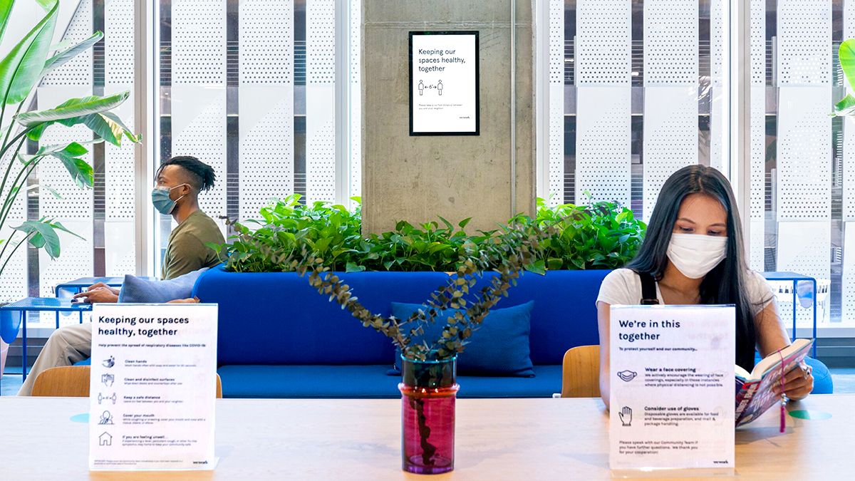 Signs that reinforce social distancing in the office