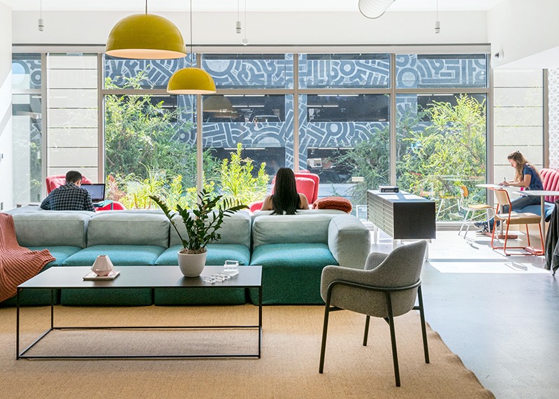 people working from comfortable lounges at WeWork 12130 Millennium Dr in Playa Vista