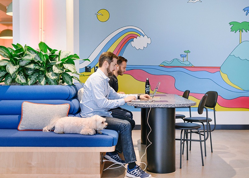 pictured two people and a dog at WeWork 222 Pacific Coast Hwy in El Segundo