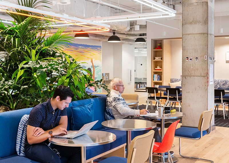 two people working from shared desks at WeWork The Hubb in Long Beach