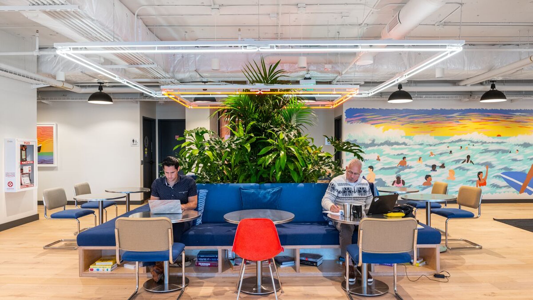 Employee experience in the work place at WeWork The Hubb Long Beach, employees in common area