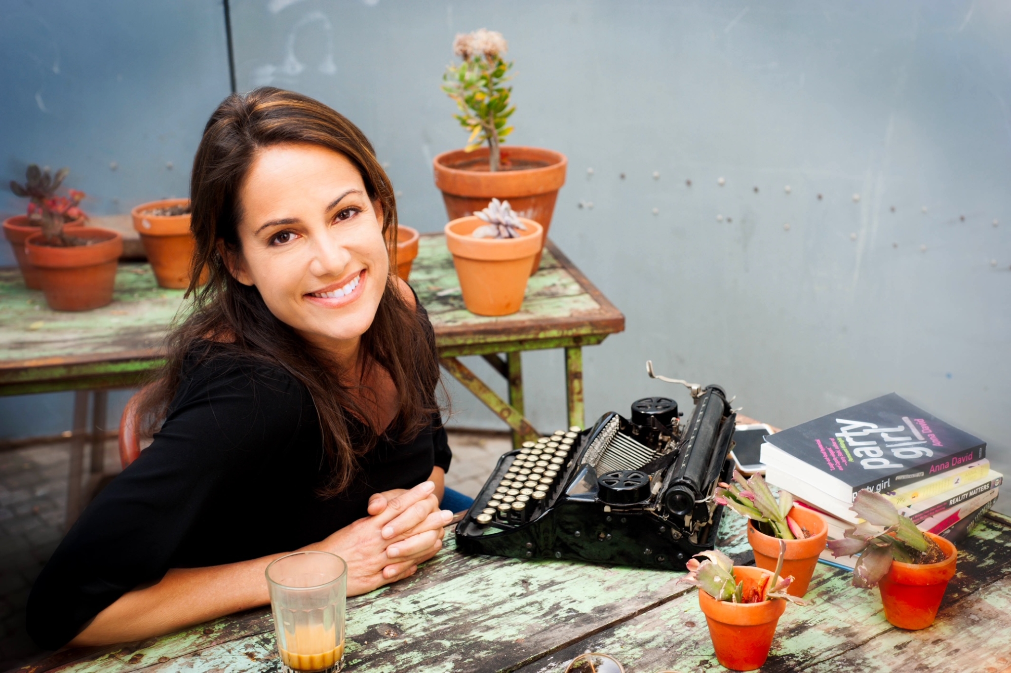 Anna David on desk with type writer