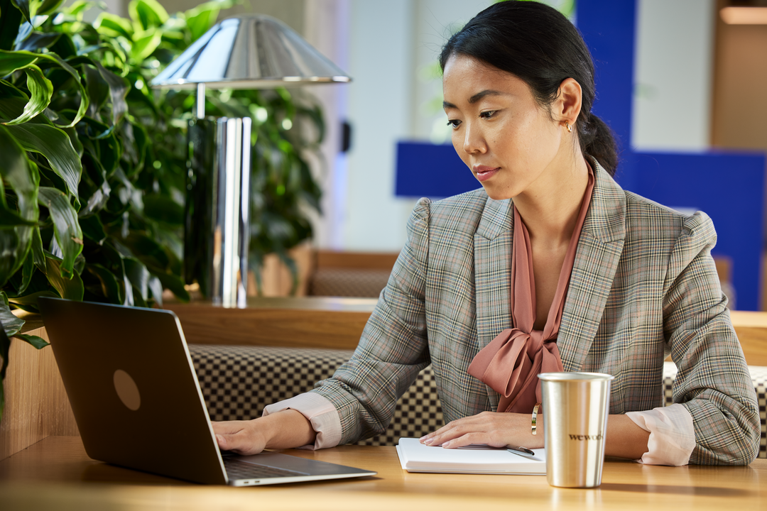 Woman researching career cushioning at WeWork