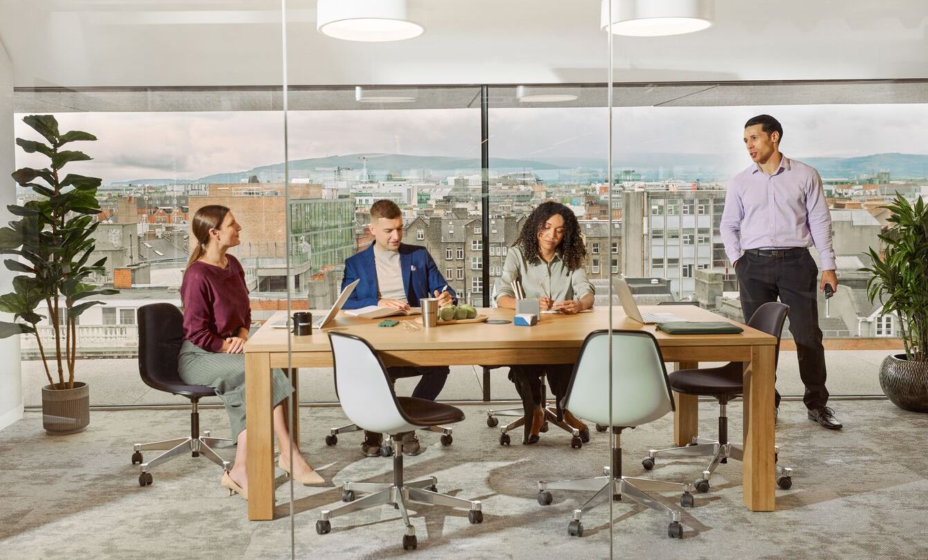 team members sitting around a table at WeWork