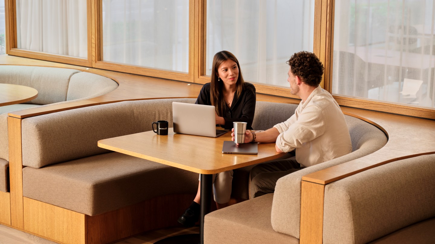 two coworkers collaborating at WeWork