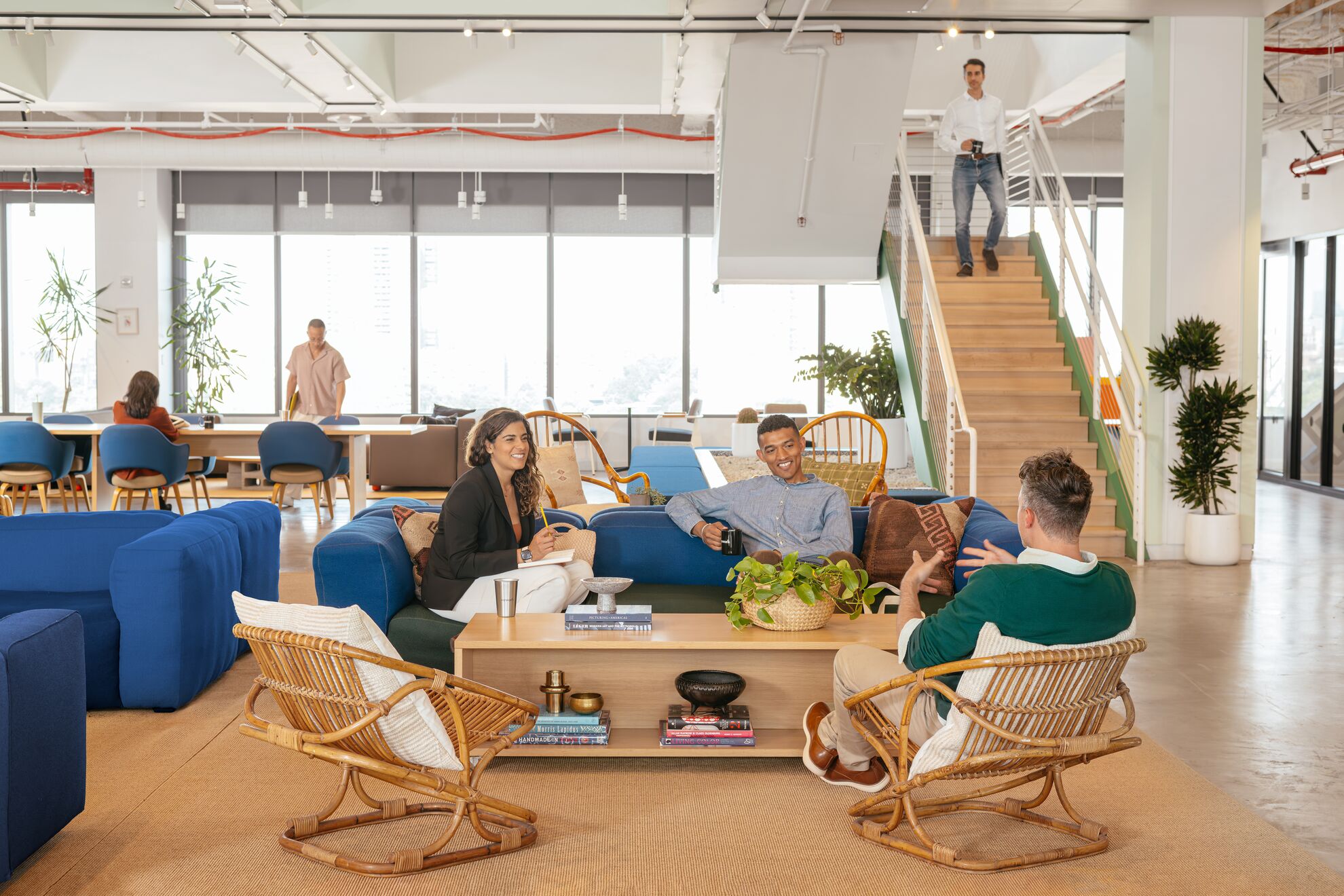 People chatting in a WeWork lounge area