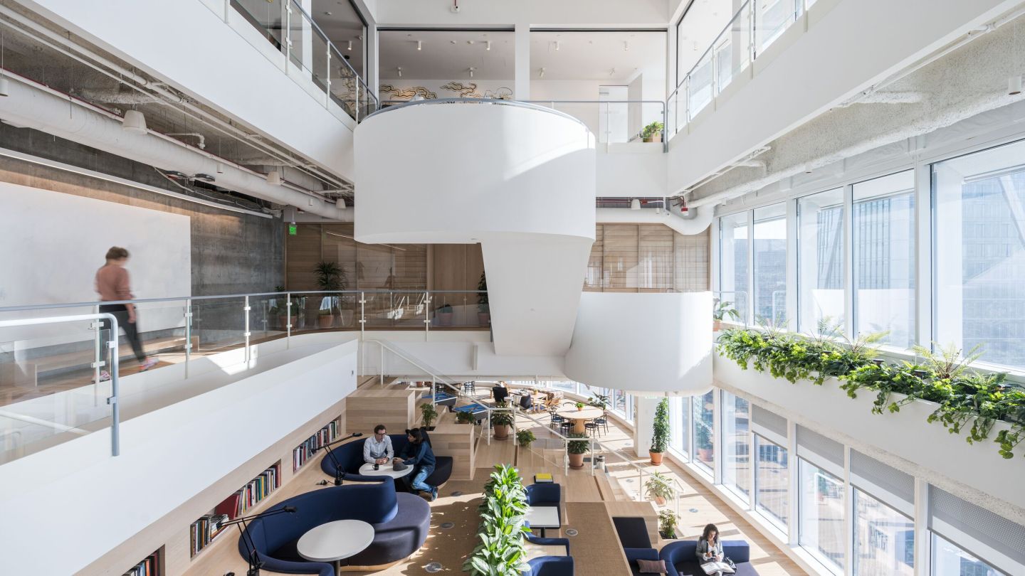 shared multi-storey WeWork space with people working