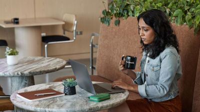 Woman looking at the computer in a coworking space