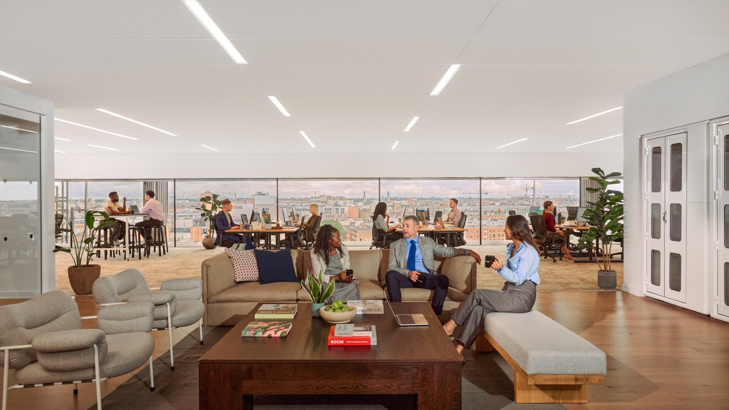 people working and socializing in a WeWork space
