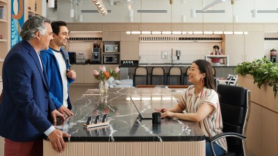 WeWork members receiving their keycards at reception on arrival
