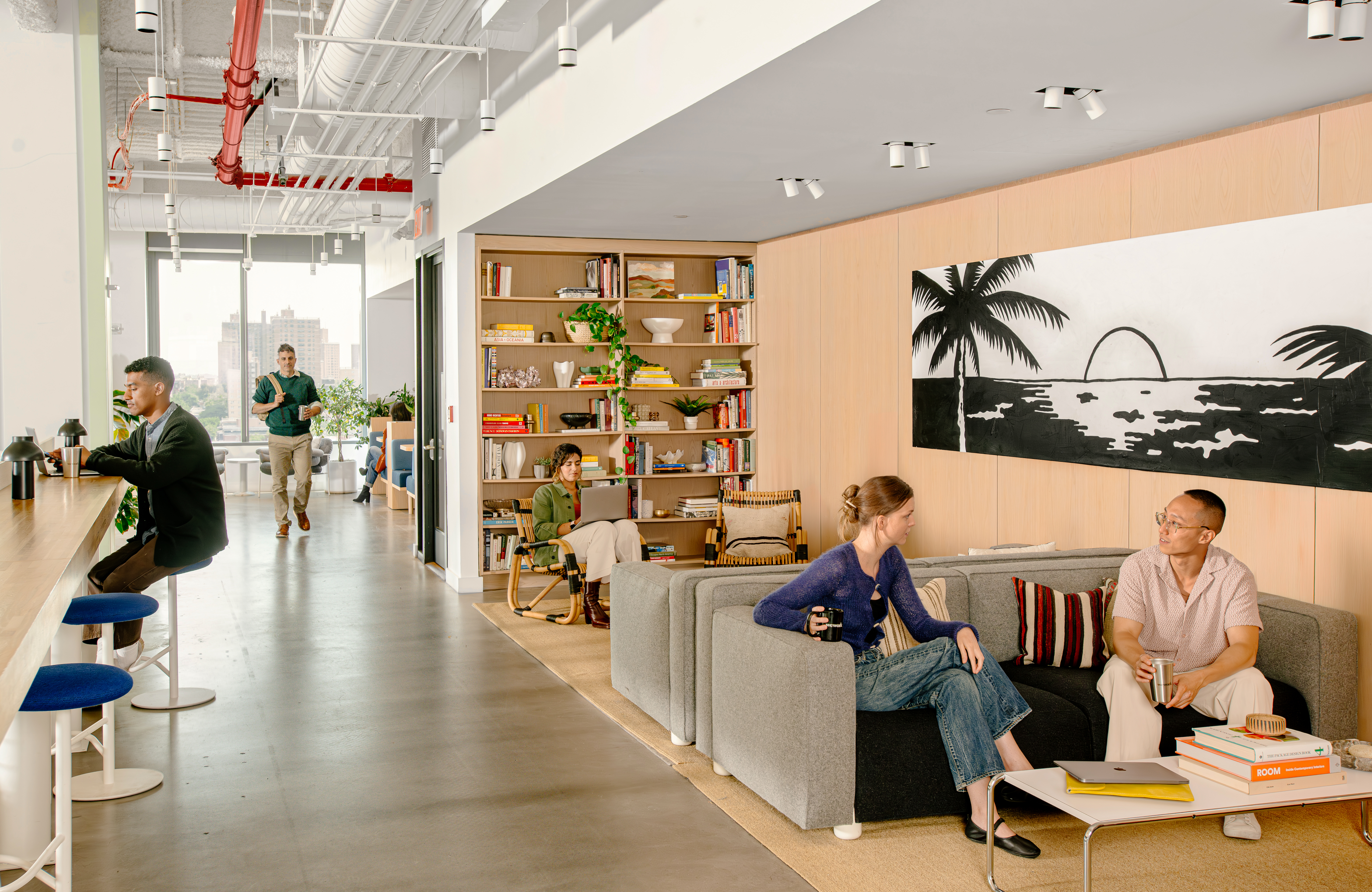 WeWork members doing different activities on a shared floor