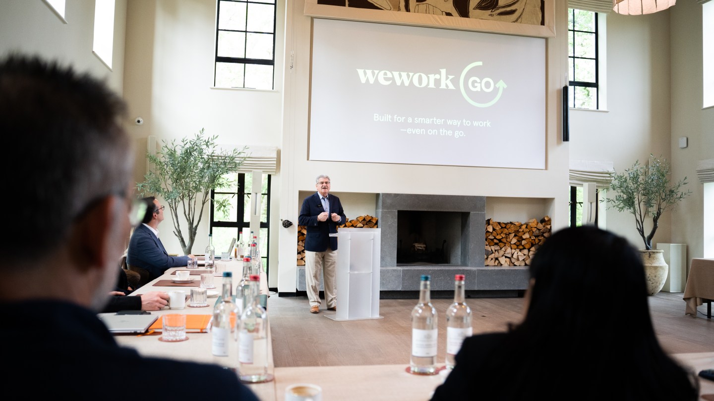 WeWork CEO John Santora pictured speaking at summit