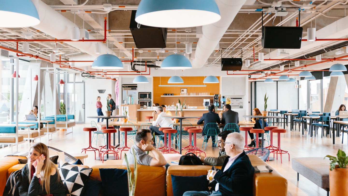 WeWork members in a shared lounge area