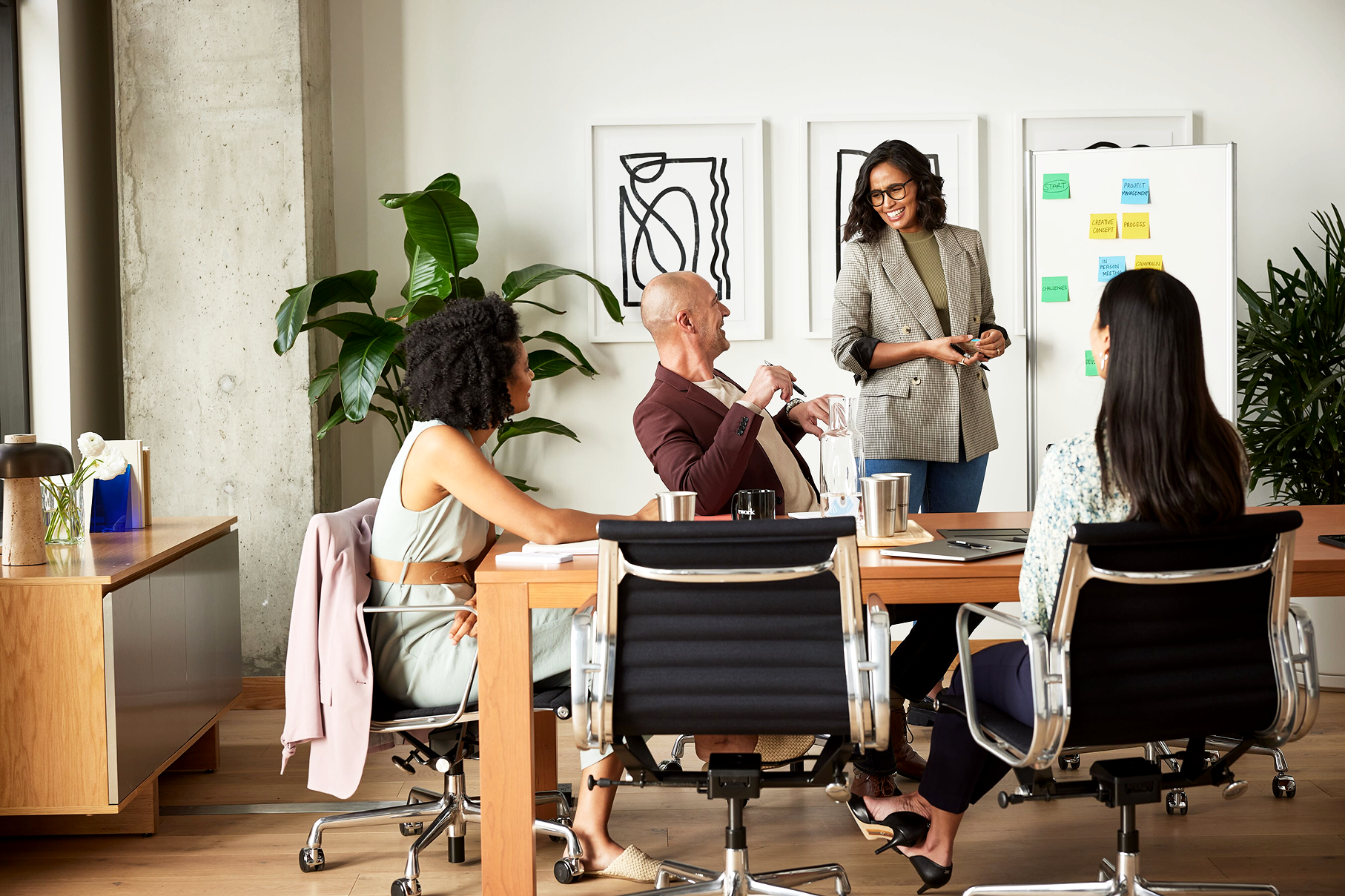 People sitting around the table for a meeting.