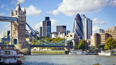 Water scenery showing the London bridge, tall buildings in the background.